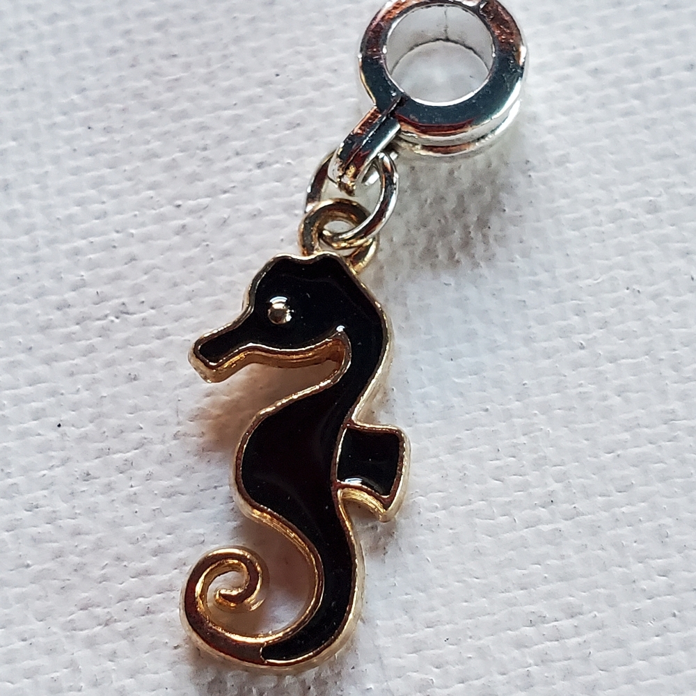 Charm. Silver and gold tone. NWOT.  Fits in Pandora snake chain Bracelet.